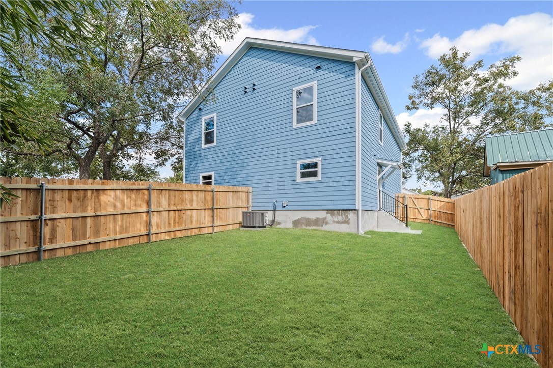602 South 18th Street, Unit B Temple, TX 76501 - Photo 23 of 24 a view of a backyard with wooden fence