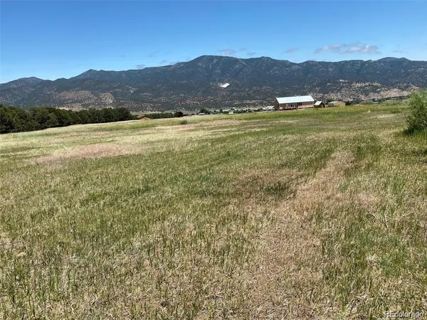 a view of an ocean and a mountain