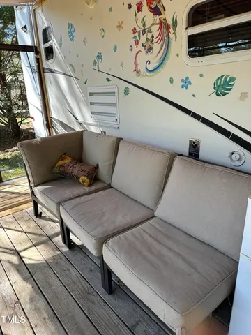 a view of living room with furniture and flat screen tv