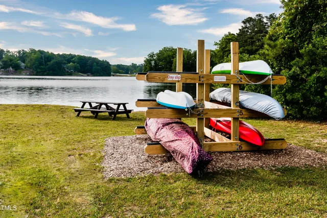 swimming pool view with a seating space