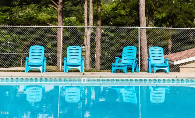 a view of a swimming pool with a lounge chair