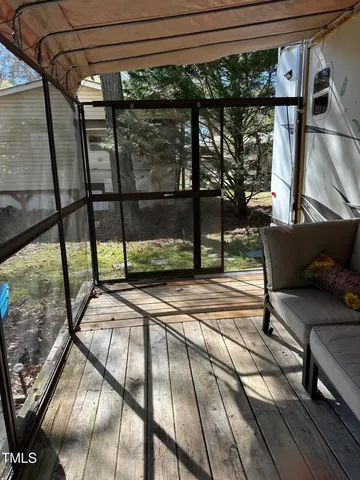 a view of swimming pool with seating area