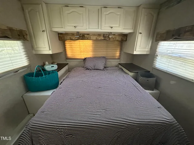 a kitchen with stainless steel appliances wooden floor sink and cabinets