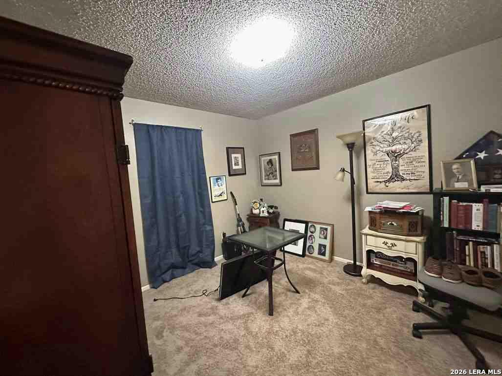 1533 Eichen Road New Braunfels, TX 78130 - Photo 17 of 24 a living room with furniture and a flat screen tv