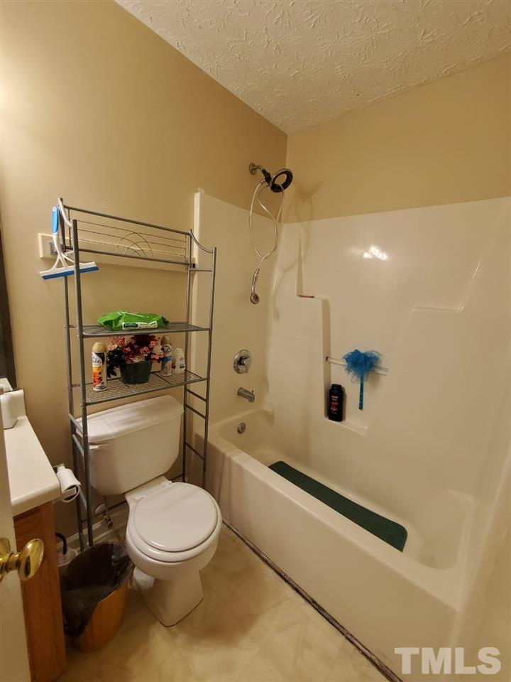 4232 Tensity Drive Raleigh, NC 27604 - Photo 13 of 13 a bathroom with a toilet and a shower