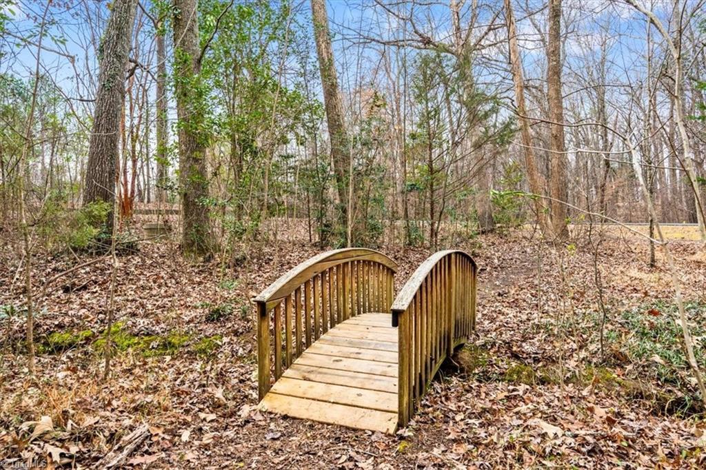 4103 Stonebrook Farms Road Greensboro, NC 27406 - Photo 46 of 50 Bridge with path to mailbox