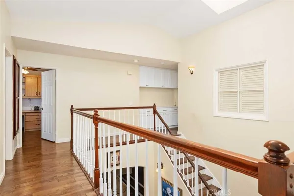 a view of an entryway with wooden floor