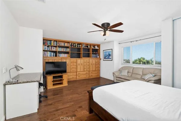 a bedroom with furniture and a bed