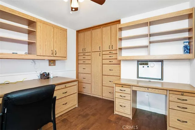 a kitchen with stainless steel appliances cabinets and a window