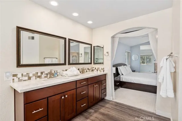 a spacious bathroom with a double vanity sink double and mirror