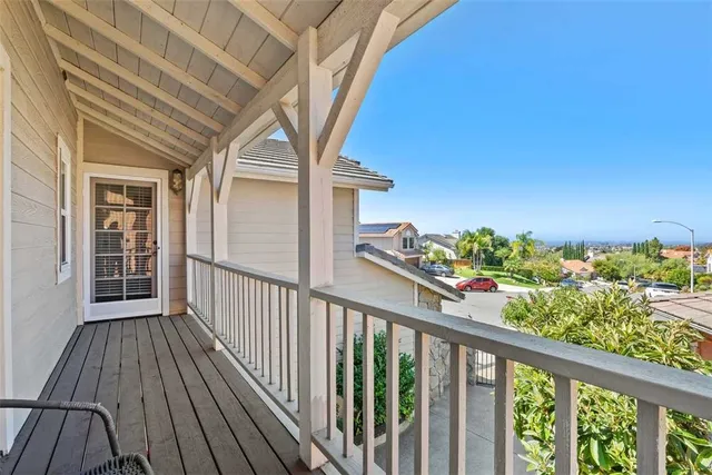 a view of a balcony with wooden floor