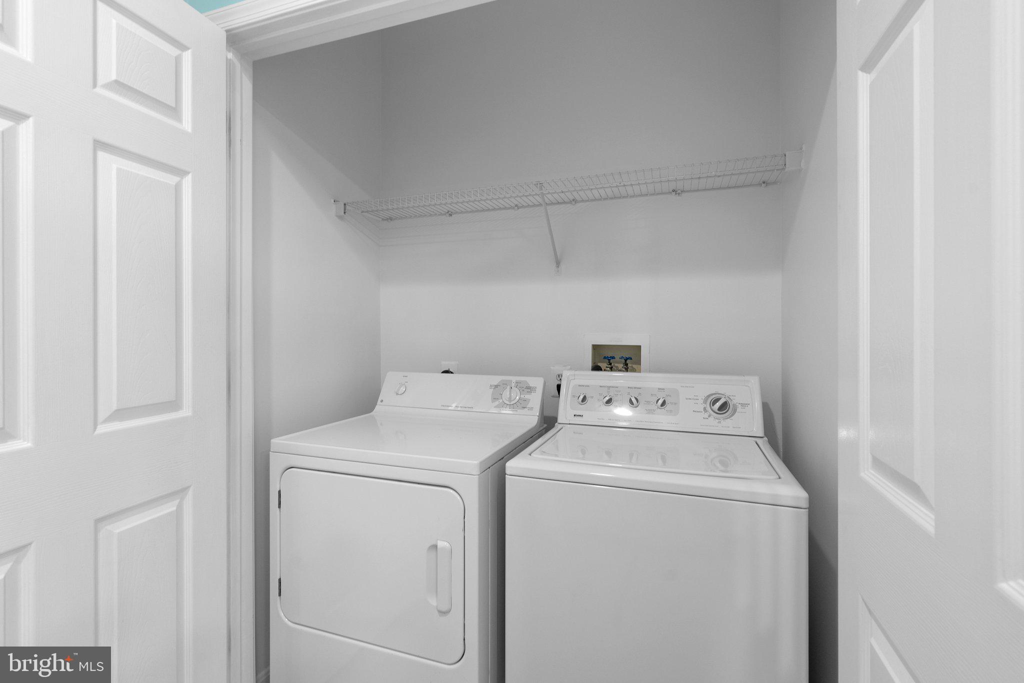 12708 Found Stone Road, Unit 3304 Germantown, MD 20876 - Photo 13 of 40 a utility room with dryer and washer