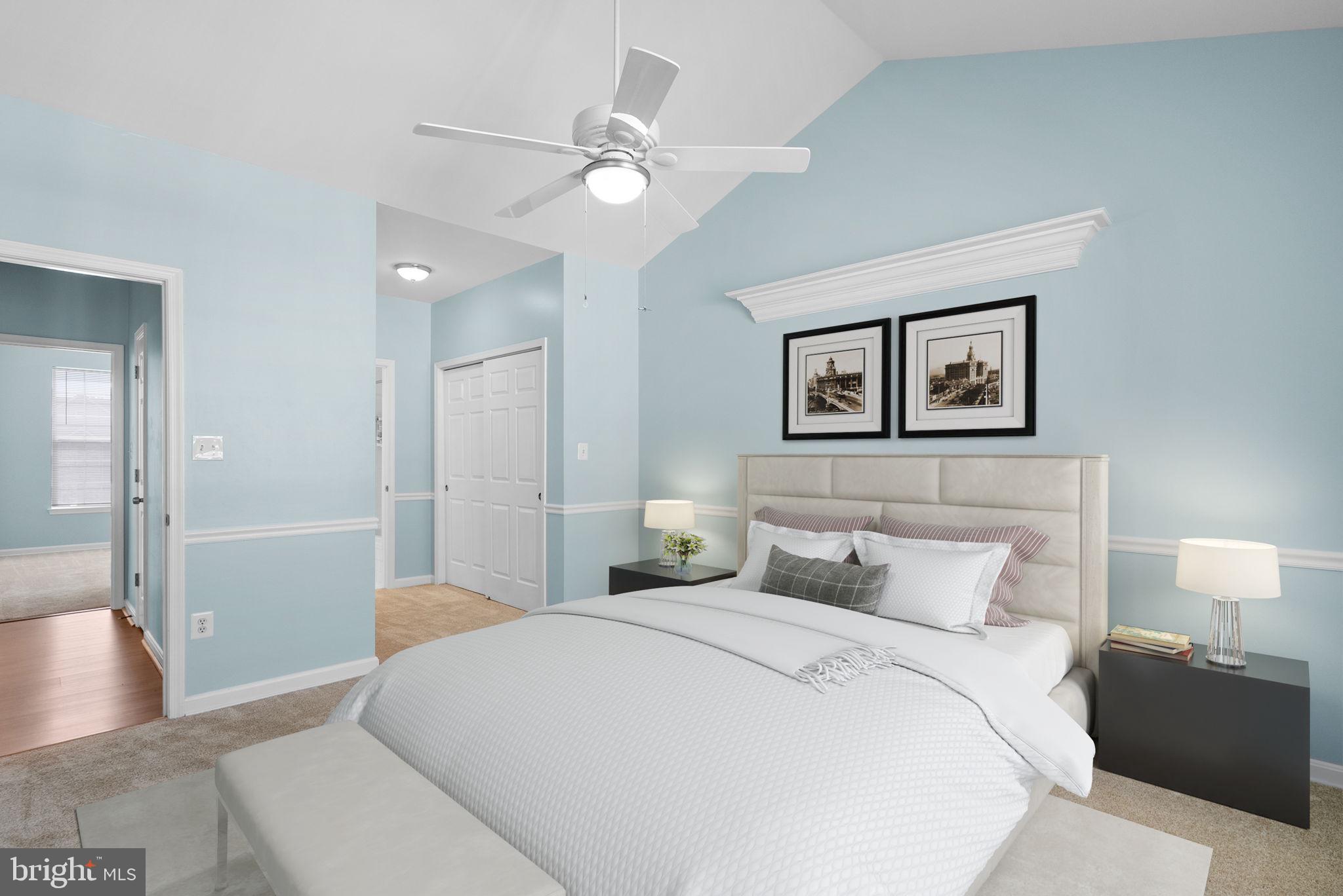 12708 Found Stone Road, Unit 3304 Germantown, MD 20876 - Photo 15 of 40 a bedroom with a bed and a chandelier