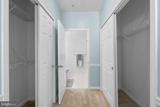 a bathroom with a sink vanity and toilet