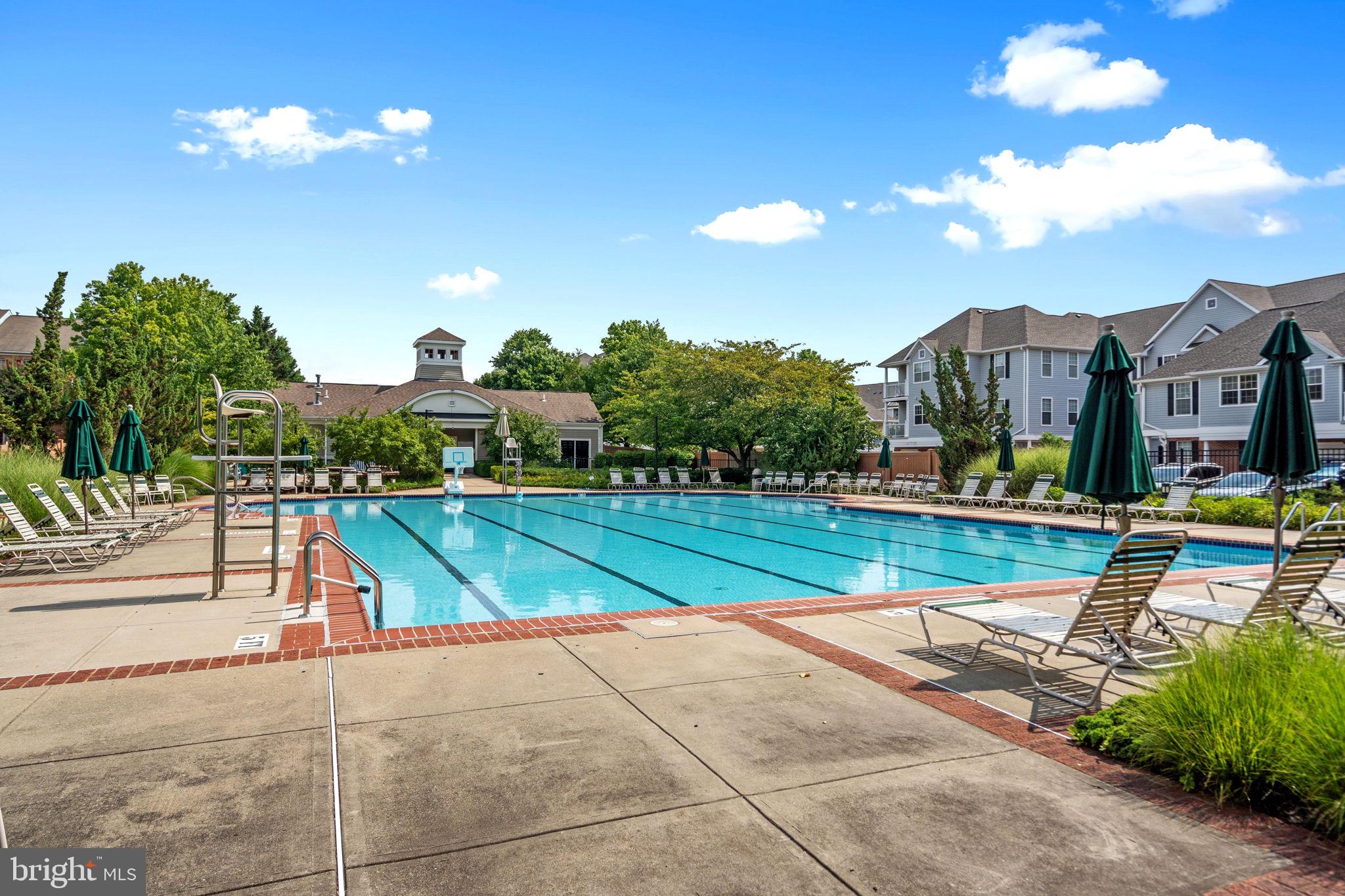 12708 Found Stone Road, Unit 3304 Germantown, MD 20876 - Photo 25 of 40 a view of swimming pool in front of residential houses with outdoor space