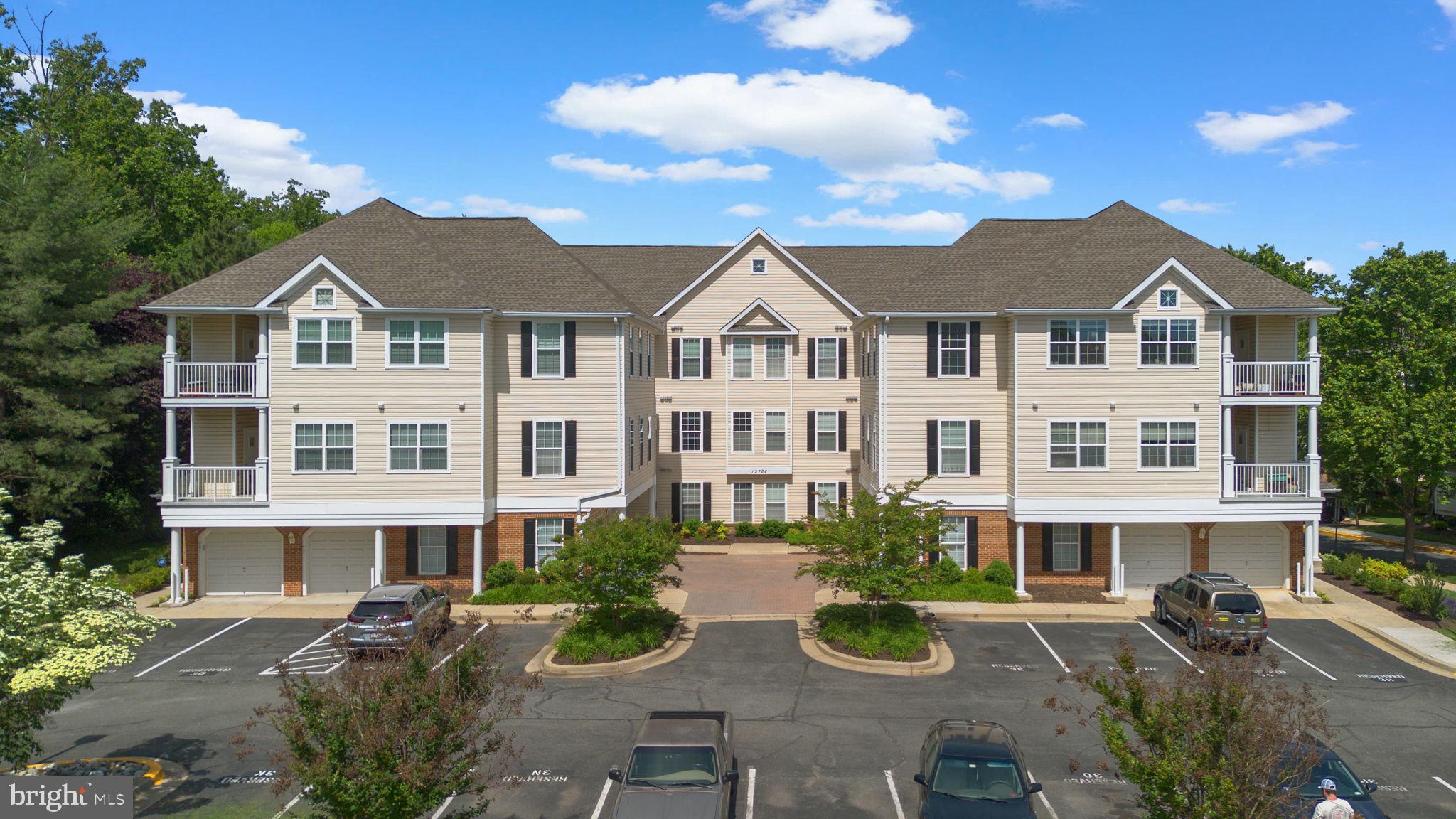 12708 Found Stone Road, Unit 3304 Germantown, MD 20876 - Photo 28 of 40 a front view of a house with yard and porch