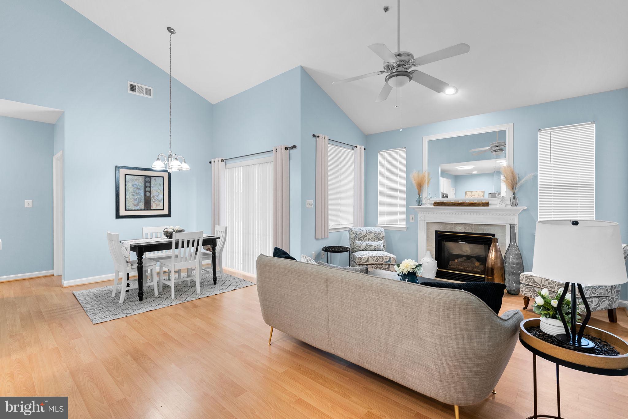 12708 Found Stone Road, Unit 3304 Germantown, MD 20876 - Photo 3 of 40 a living room with furniture and a fireplace