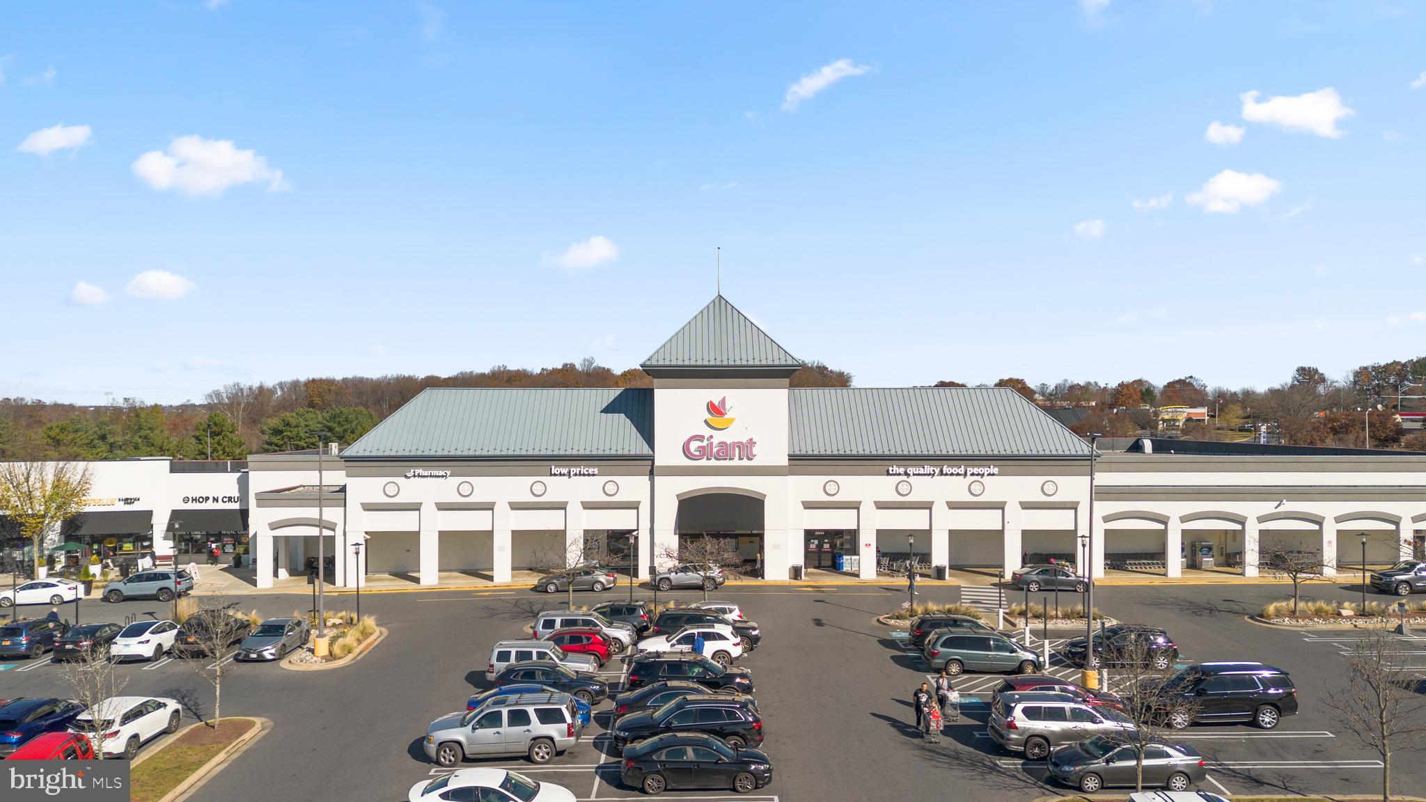12708 Found Stone Road, Unit 3304 Germantown, MD 20876 - Photo 36 of 40 a front view of a house with yard swimming pool and outdoor seating