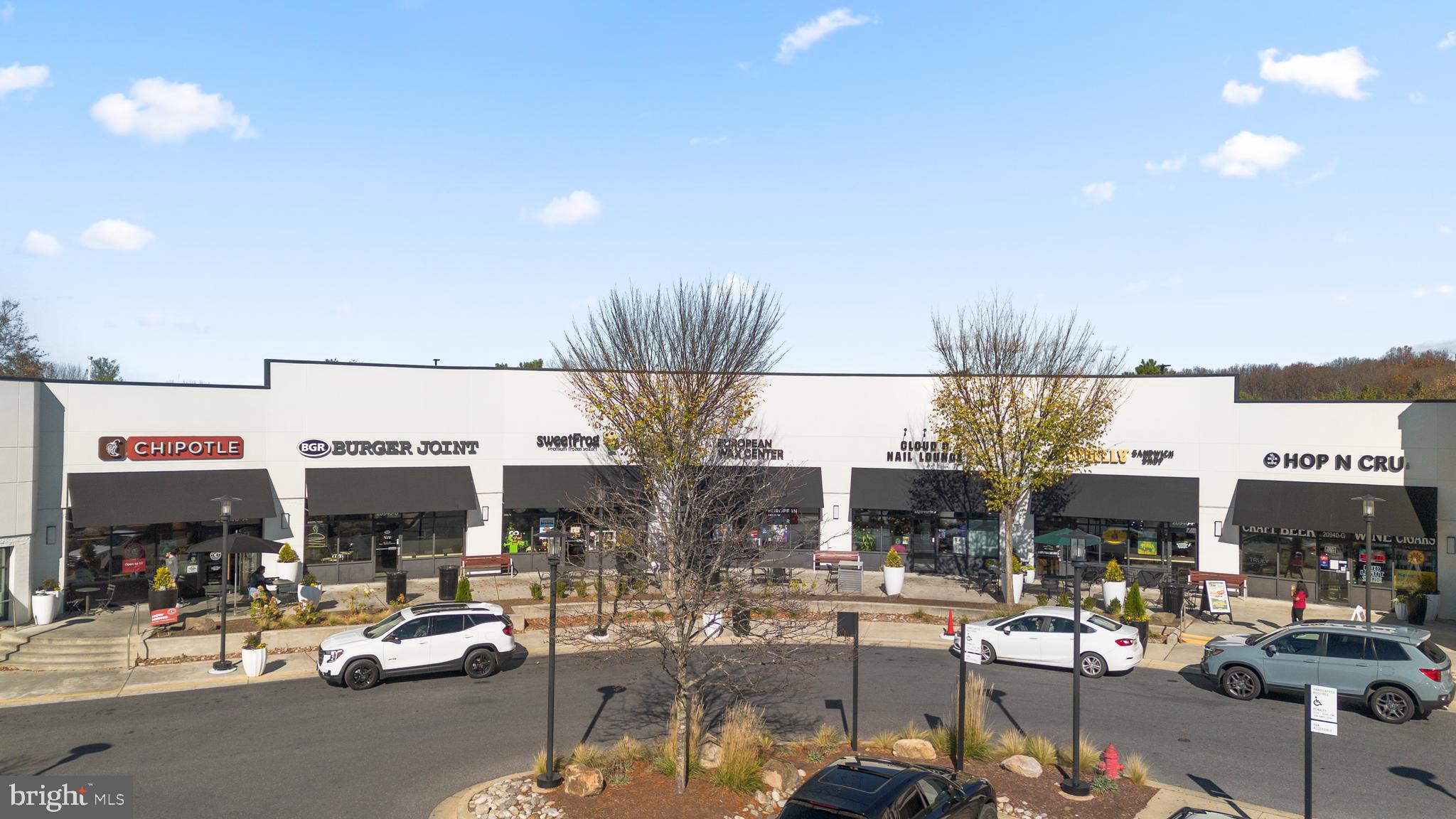 12708 Found Stone Road, Unit 3304 Germantown, MD 20876 - Photo 37 of 40 a living room with lots of furniture and a fireplace