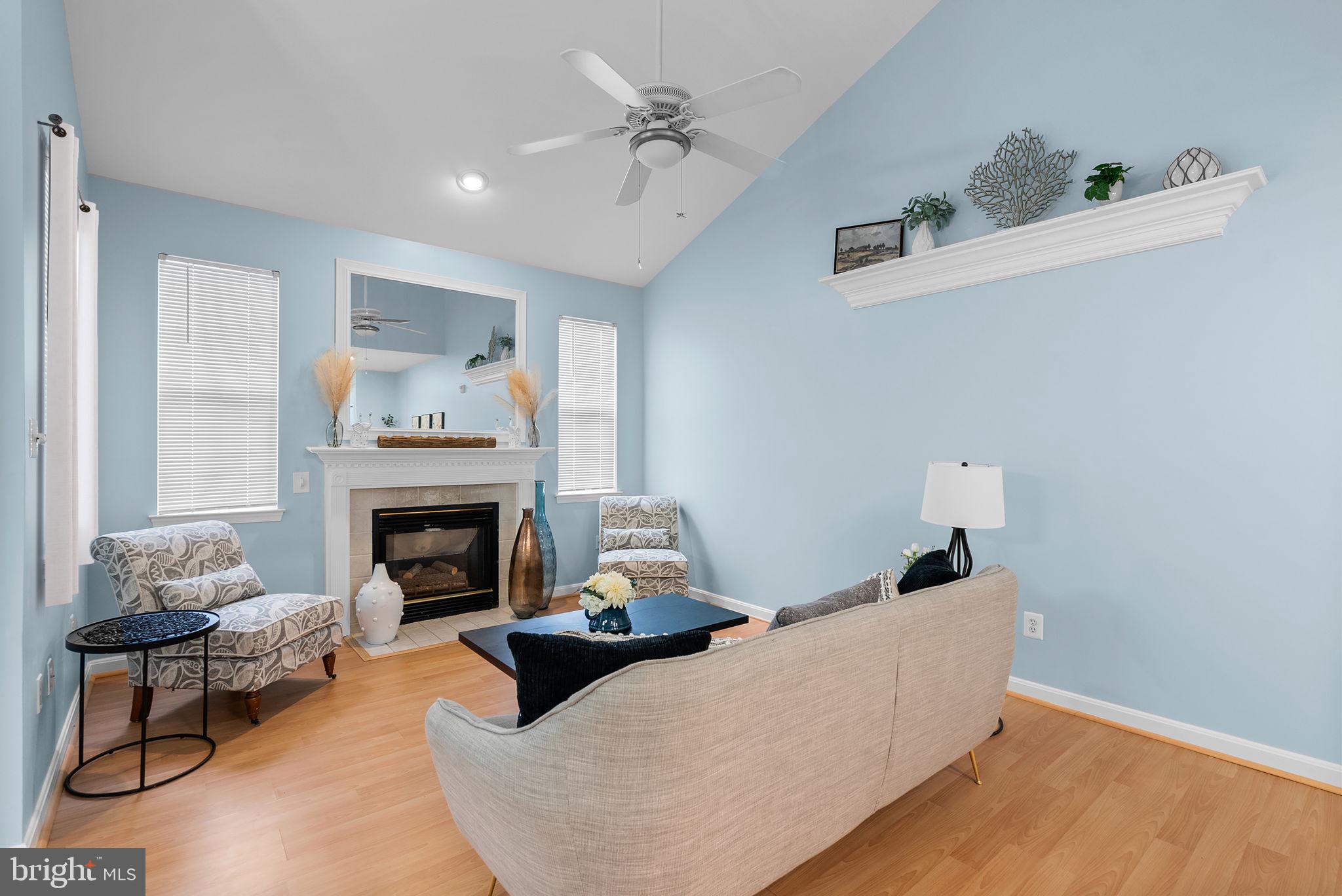 12708 Found Stone Road, Unit 3304 Germantown, MD 20876 - Photo 4 of 40 a living room with furniture and a fireplace