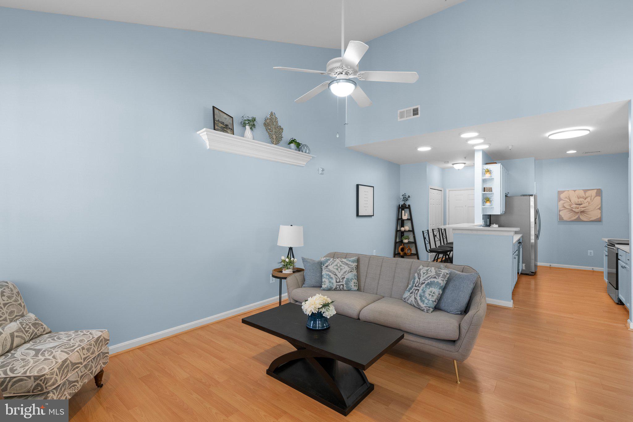 12708 Found Stone Road, Unit 3304 Germantown, MD 20876 - Photo 5 of 40 a living room with furniture and a table