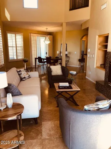 a living room with furniture and a table