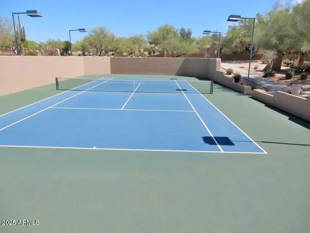 a view of an outdoor space and tennis court