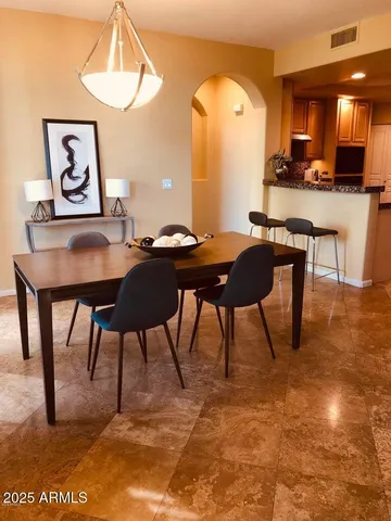 a view of a dining room with furniture