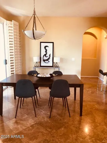 a living room with a couch a rug and a window