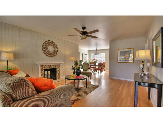 262 Maria Street Santa Clara, CA 95050 - Photo 6 of 22 a living room with furniture a clock and a fireplace
