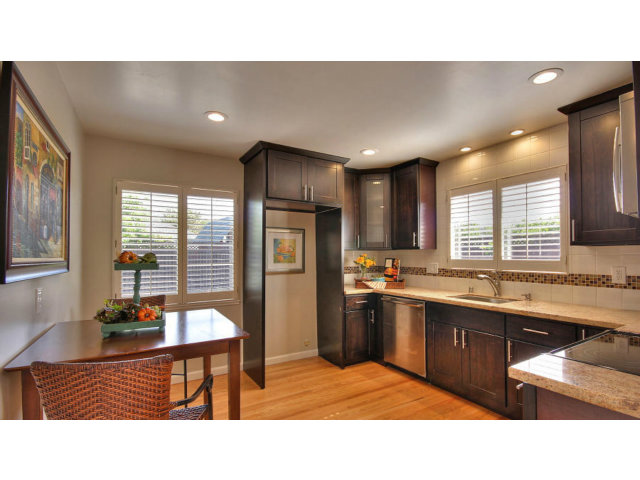 262 Maria Street Santa Clara, CA 95050 - Photo 10 of 22 a kitchen with stainless steel appliances granite countertop a sink wooden cabinets and a refrigerator