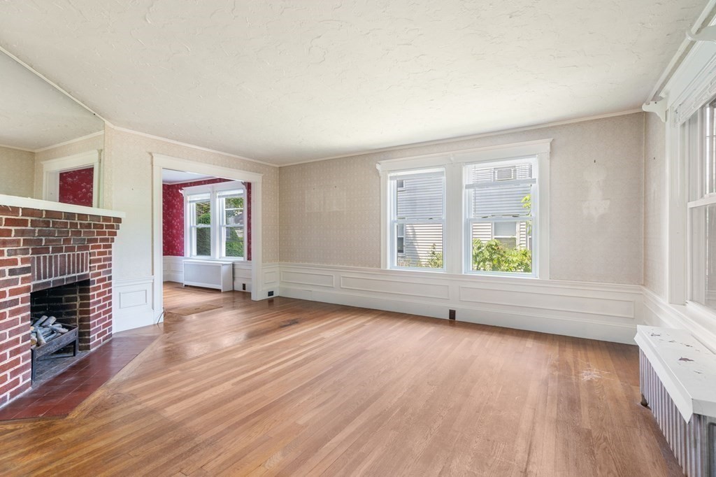 39 Reedsdale Road Milton, MA 02186 - Photo 4 of 25 wooden floor in an empty room with a window