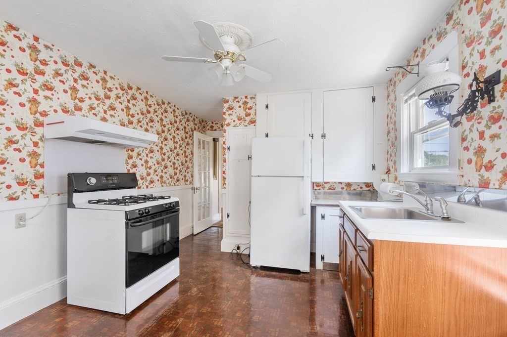 39 Reedsdale Road Milton, MA 02186 - Photo 6 of 25 a kitchen with a stove and a sink