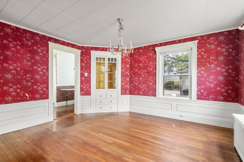 39 Reedsdale Road Milton, MA 02186 - Photo 10 of 25 a view of empty room with wooden floor and fan