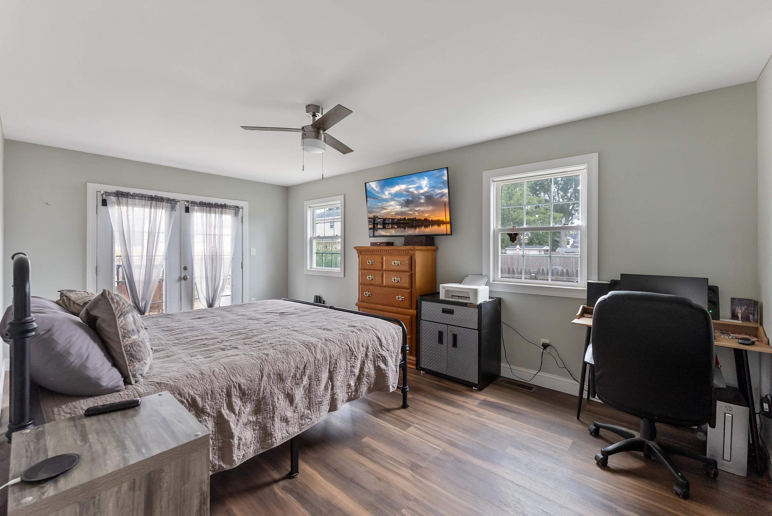 134 Arbor Road Villas, NJ 08251 - Photo 12 of 27 a bedroom with a bed and a chair