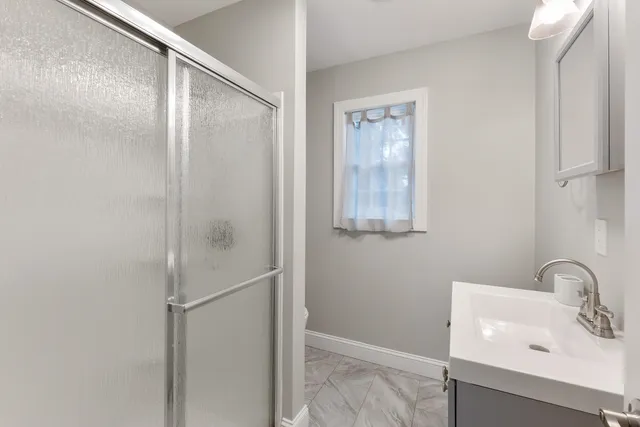 a bathroom with a sink and mirror