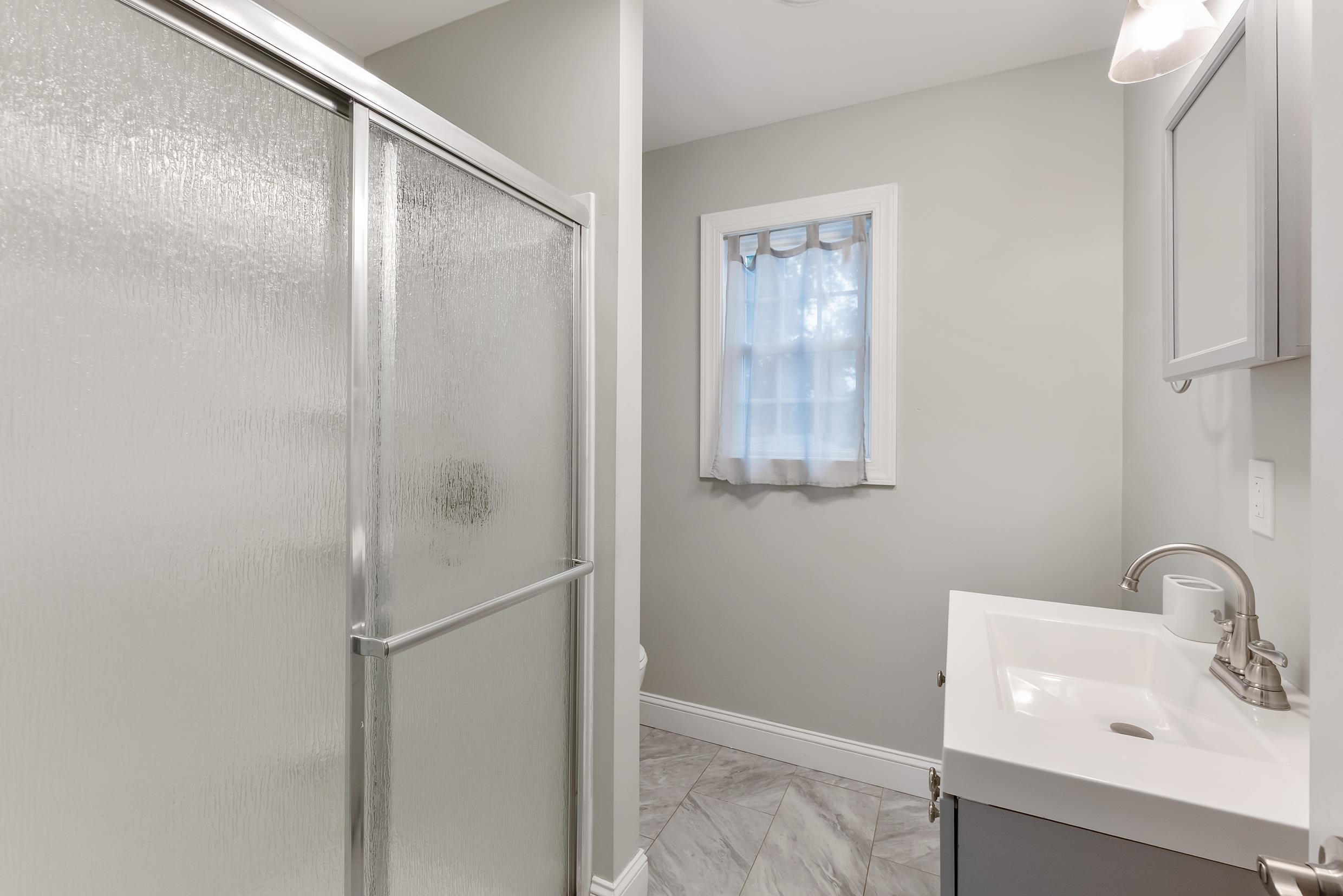 134 Arbor Road Villas, NJ 08251 - Photo 20 of 27 a bathroom with a sink and mirror