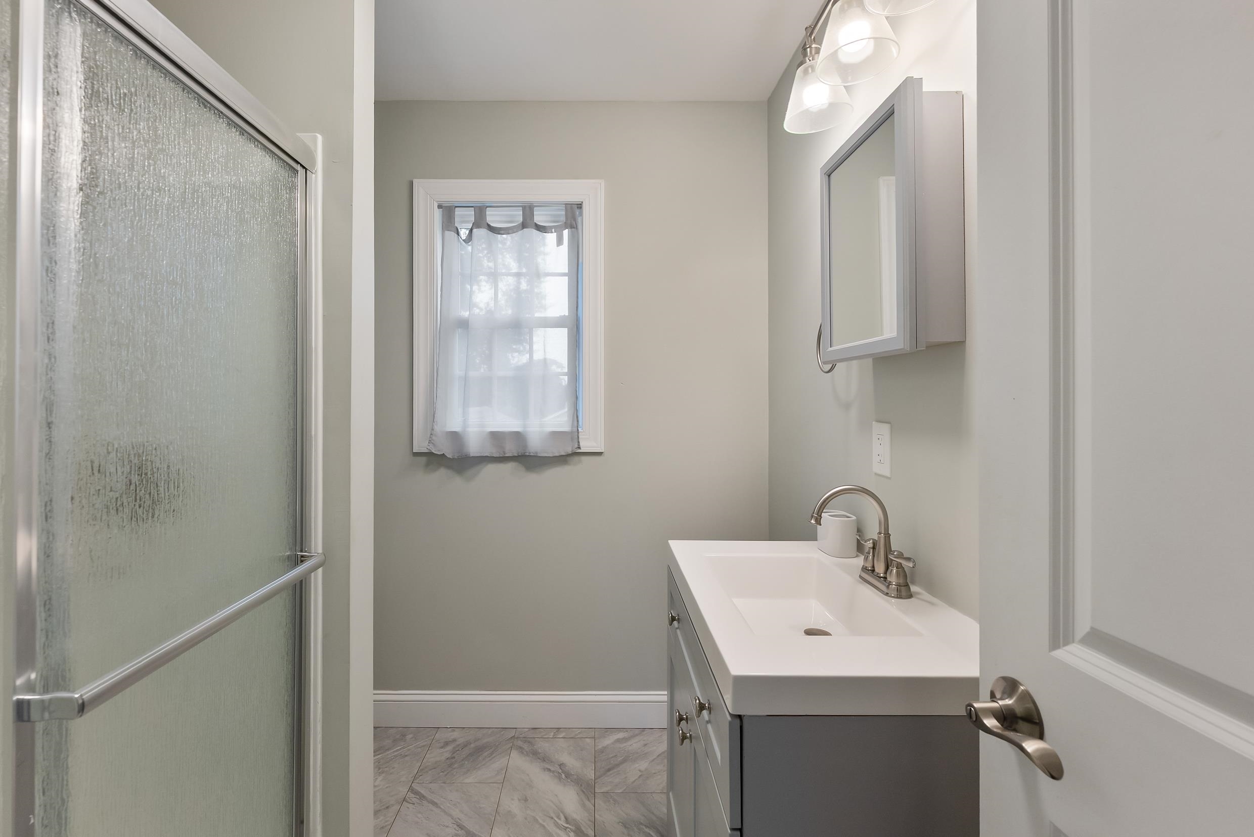 134 Arbor Road Villas, NJ 08251 - Photo 21 of 27 a bathroom with a sink toilet and vanity