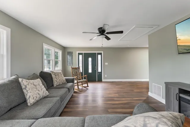 a living room with furniture and a window