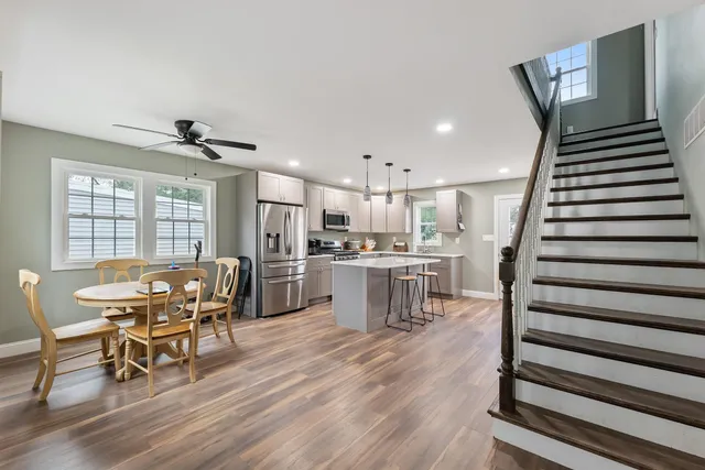 a view of a dining room with furniture and wooden floor