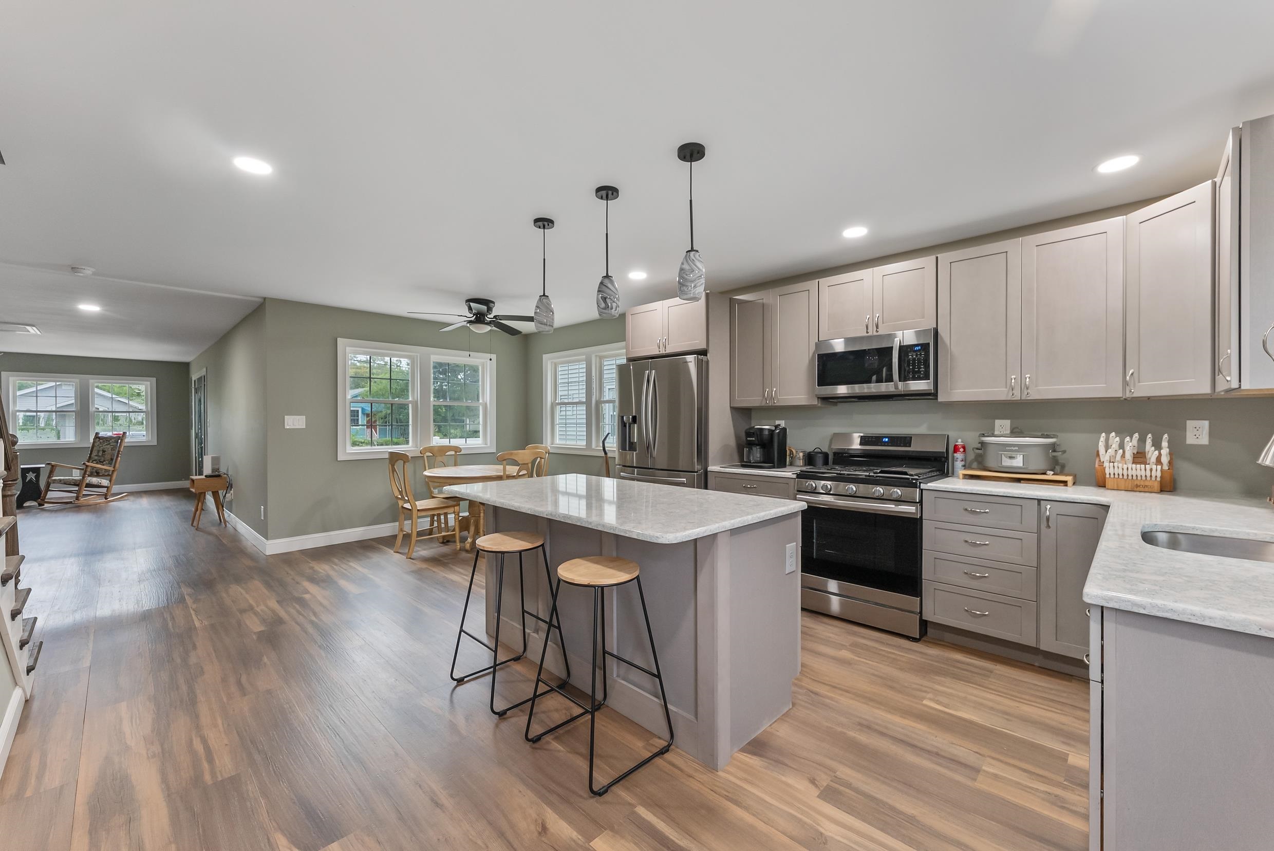 134 Arbor Road Villas, NJ 08251 - Photo 10 of 27 a kitchen with stainless steel appliances kitchen island granite countertop a stove a sink a refrigerator and a microwave