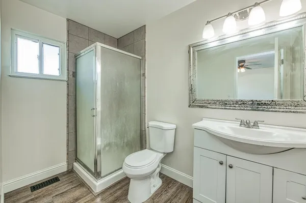 a view of a kitchen with a sink and cabinets