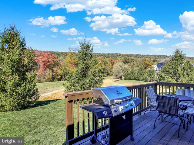 a view of roof deck with furniture