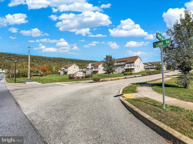 a view of a house with a backyard porch and sitting area