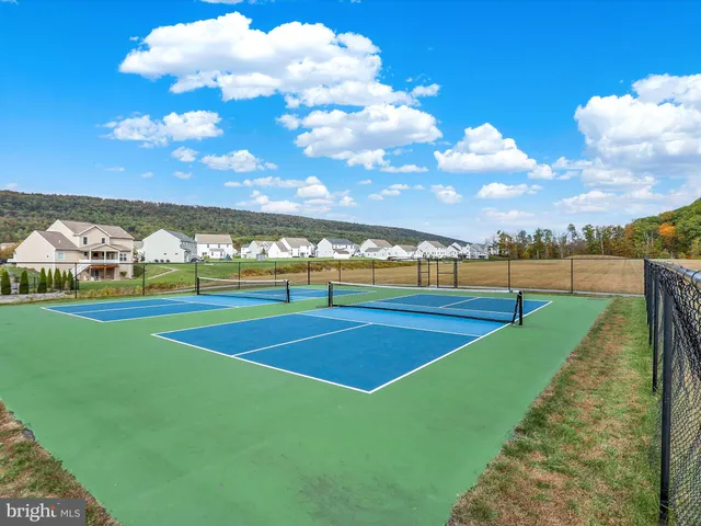 an aerial view of a house with a garden