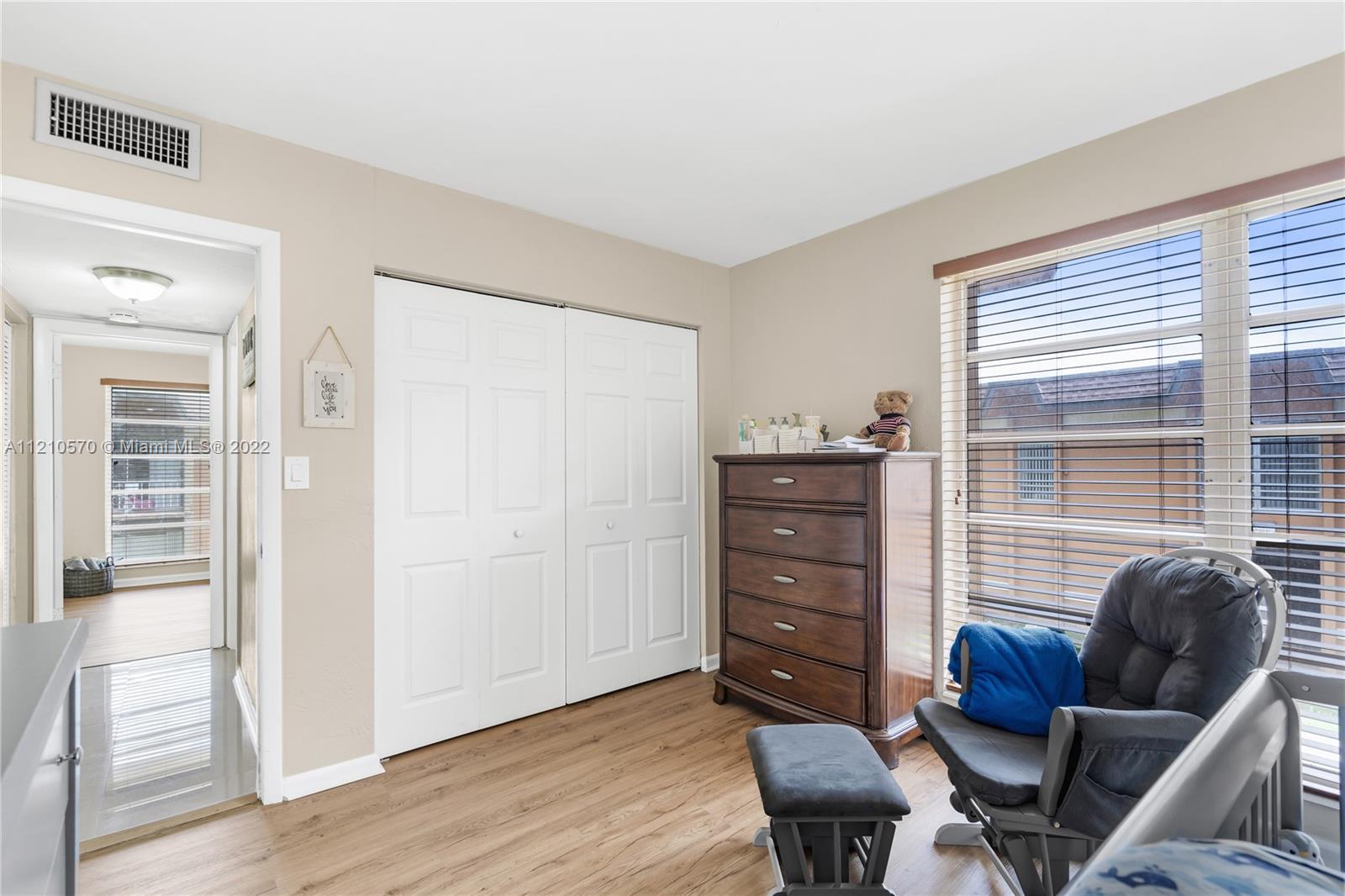 9459 Southwest 76th Street, Unit R7 Miami, FL 33173 - Photo 18 of 24 a view of a livingroom with furniture and windows