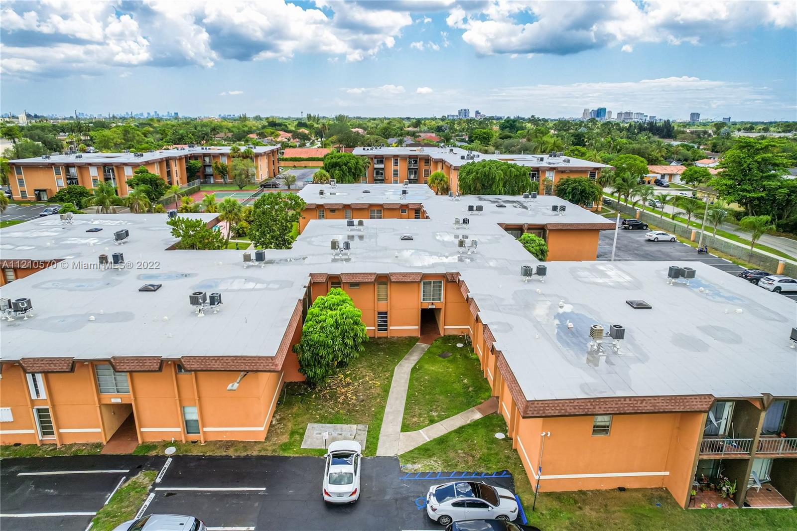 9459 Southwest 76th Street, Unit R7 Miami, FL 33173 - Photo 2 of 24 an aerial view of residential houses with outdoor space