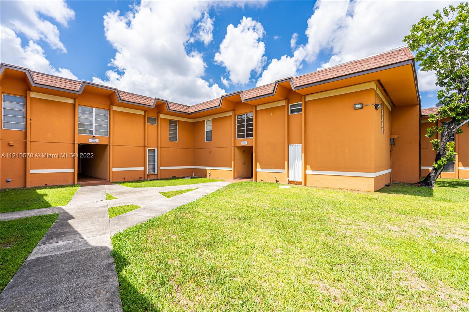 9459 Southwest 76th Street, Unit R7 Miami, FL 33173 - Photo 6 of 24 a house view with a backyard space