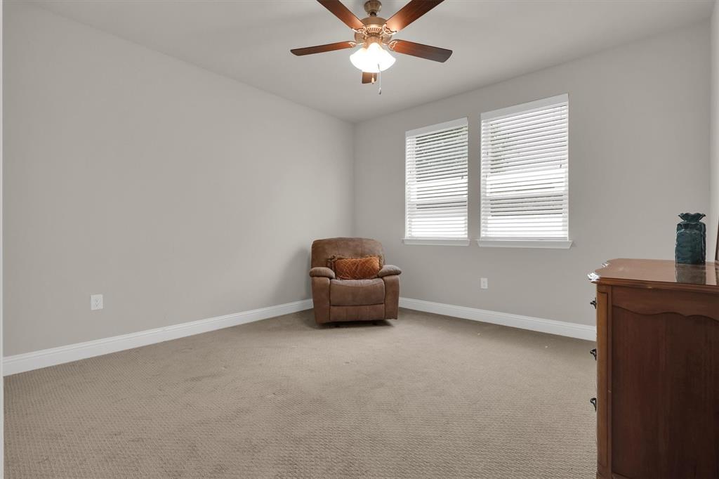 651 Watters Road, Unit 2105 Allen, TX 75013 - Photo 13 of 32 a room with a window and a ceiling fan