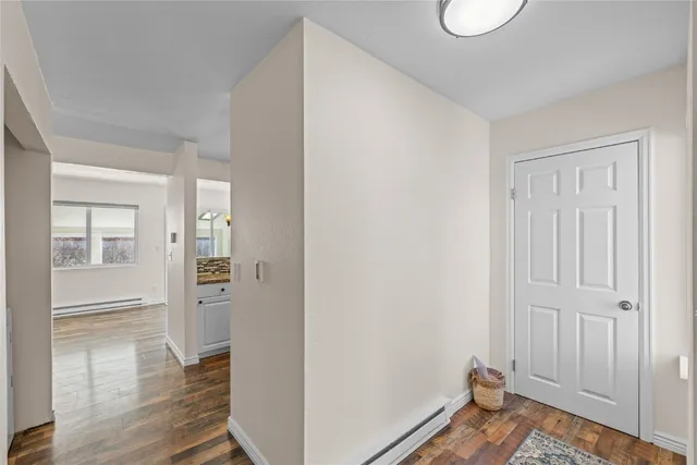 a view of a room with wooden floor and closet